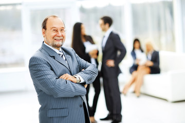 Fototapeta premium portrait of a successful businessman on background of office