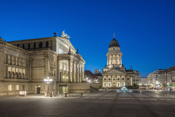 Fototapeta na wymiar French Cathedral (Franzoesischer Dom) and Konzerthaus located on the Gendarmenmarkt in Berlin at evening, Germany, Europe 