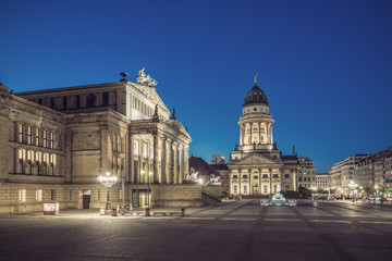 Fototapeta na wymiar French Cathedral (Franzoesischer Dom) and Konzerthaus located on the Gendarmenmarkt in Berlin at evening, Germany, Europe, Vintage filtered style