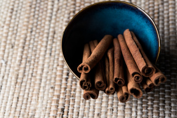 Organic Cinnamon sticks in a blue bowl