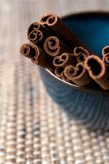Organic Cinnamon sticks in a blue bowl