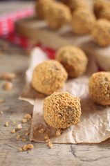Sweet peanut balls on wooden background
