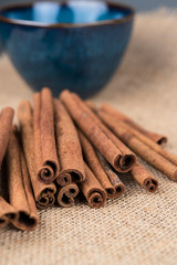 Organic Cinnamon sticks in a blue bowl