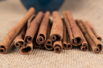 Organic Cinnamon sticks in a blue bowl