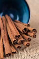 Organic Cinnamon sticks in a blue bowl