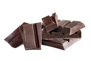 Pieces of dark chocolate isolated on white background