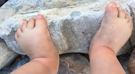 Baby Feet on a River Rock