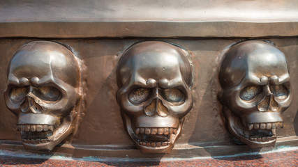 Bronze bas reliefs skull