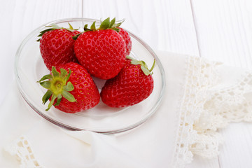 Strawberries on white table