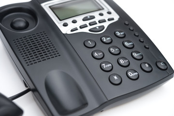 black telephone on a white background
