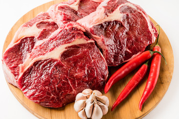 Obraz premium raw beef meat with chili pepper