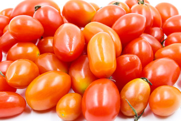 Grape or cherry tomatoes isolated on white background.