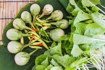 true vegetable on leaf and bamboo blind floor