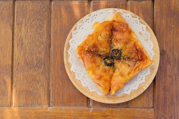 Toasted cheese pizza and onion.