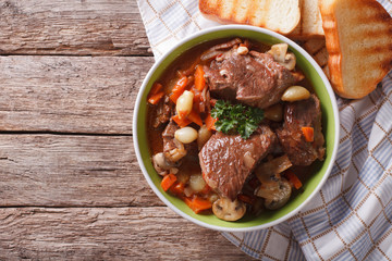 Homemade Beef Bourguignon in a bowl. horizontal top view
