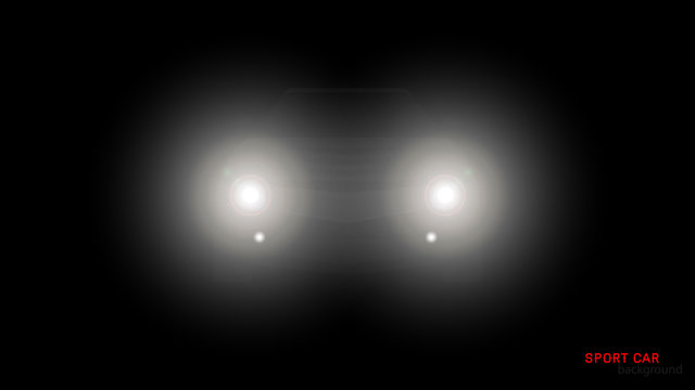 Silhouette of car with headlights on black background