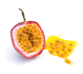 passion fruit cut out with some juice on a white background