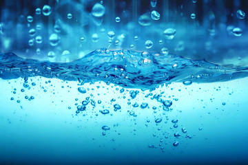 Close up blue Water splash with rain water drop falling down