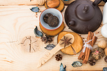 dry tea leaves cinnamon and on wooden background