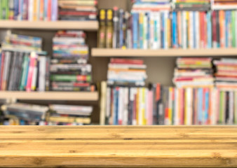 Empty wood table top for product disply with blur book shelf 
