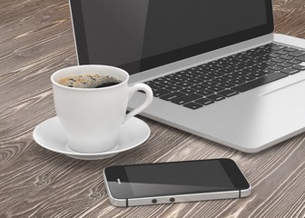 Obraz na płótnie Canvas Laptop smartphone and coffee cup on wood table
