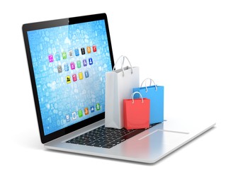 laptop and  shopping pags on white background