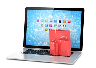 laptop and  shopping pags on white background