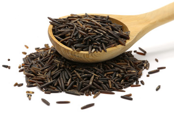 Wild rice in a wooden spoon