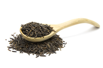 Wild rice in a wooden spoon
