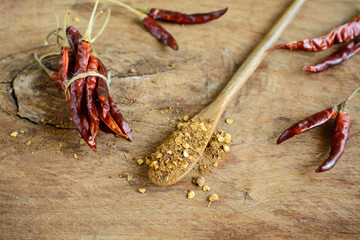Dried chilli peppers on rustic wooden