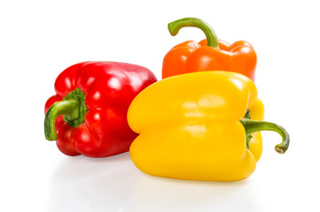 Red, orange and yellow paprika isolated