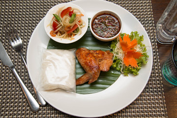  Green papaya salad, grilled chicken and sticky rice