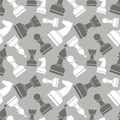 Seamless vector chaotic pattern with grey and white chess pieces. Series of Gaming and Gambling Patterns.