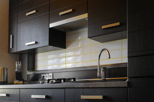 Contemporary modern fully fitted kitchen in brown with top spec appliances