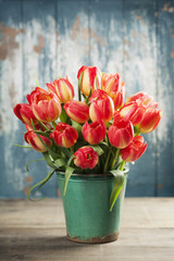 Beautiful tulips bouquet on wooden table