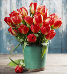 Beautiful tulips bouquet on wooden table