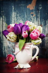 Beautiful tulips bouquet  on wooden table