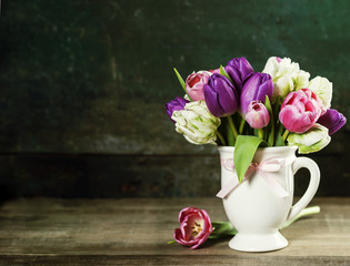 Beautiful tulips bouquet  on wooden table