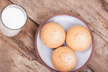 chip cookies, milk, rustic wood background, top view