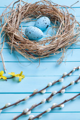 Obraz premium Easter eggs on a wooden background
