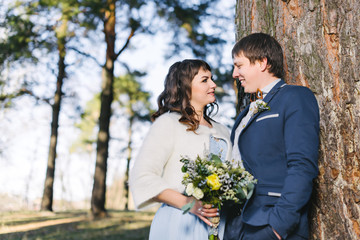 Married Couple in forest embracing