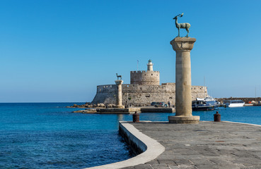 Mandraki harbor entrance, Rhodes Greece © filipposfilippou