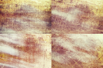 Set of four orange colored grunge texture backgrounds