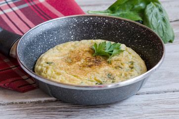 Omelet with spinach on plate