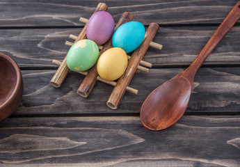 Easter eggs composition on wooden background