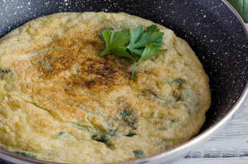 Omelet with spinach on plate