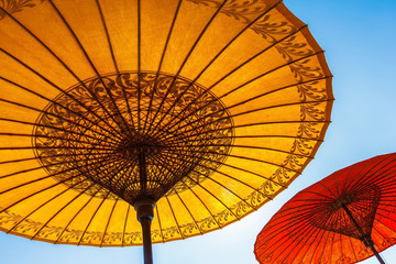 colorful umbrellas and back light sky