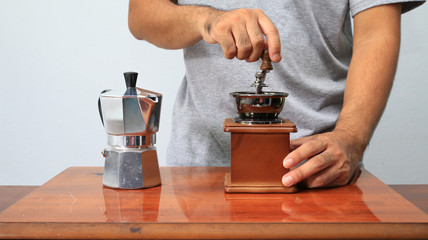 Man take coffee grinder.