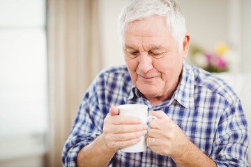 Senior man having a cup of coffee