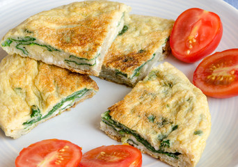 Omelet with spinach on plate